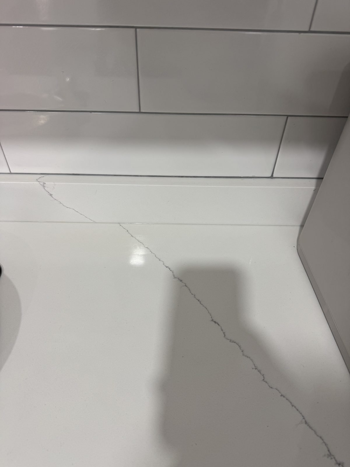 Kitchen counter after cleaning — spotless quartz and backsplash