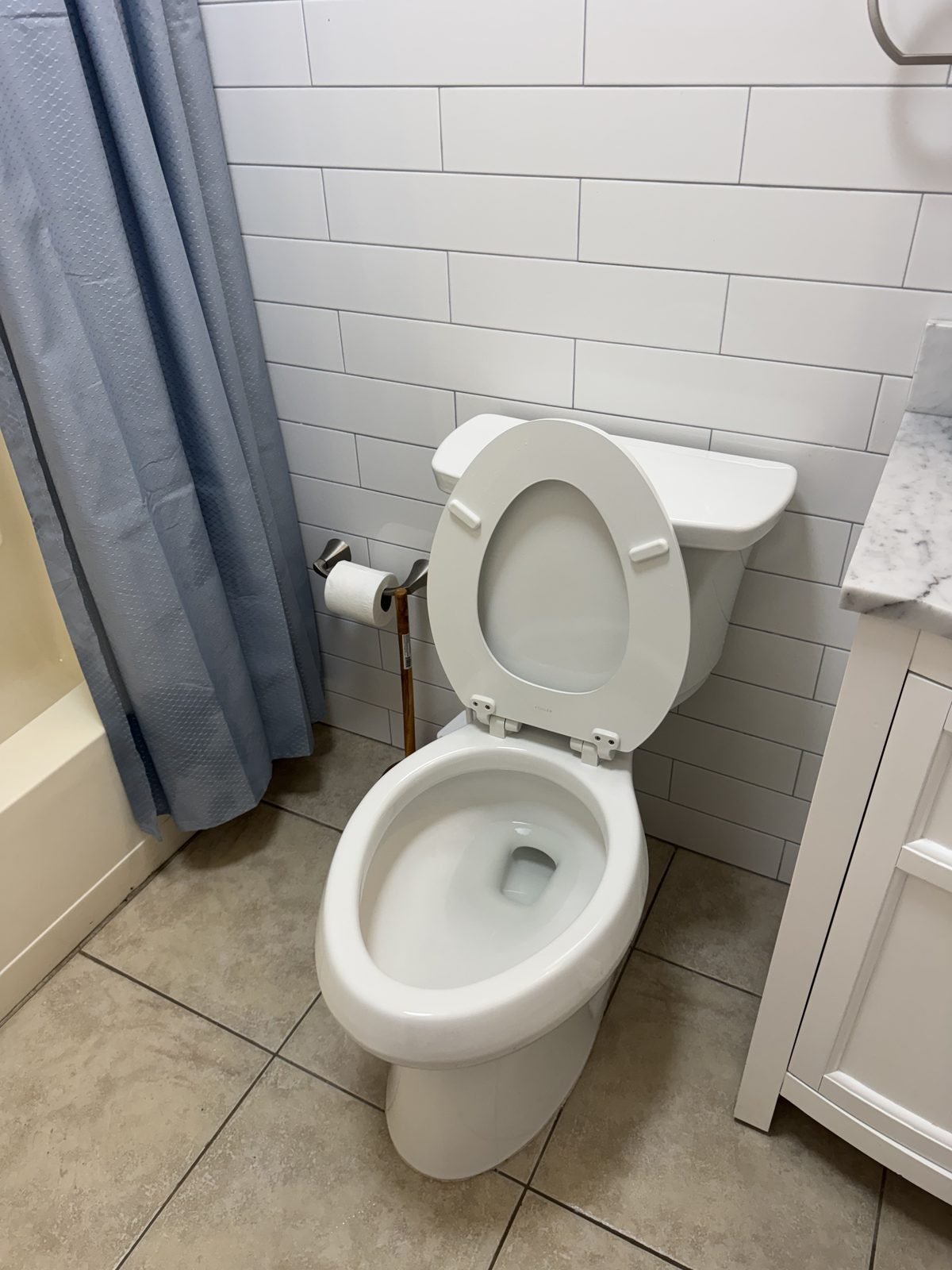 Clean bathroom with spotless toilet and tile